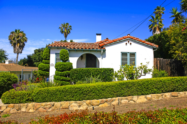 a Spanish-style home on a hillside in California