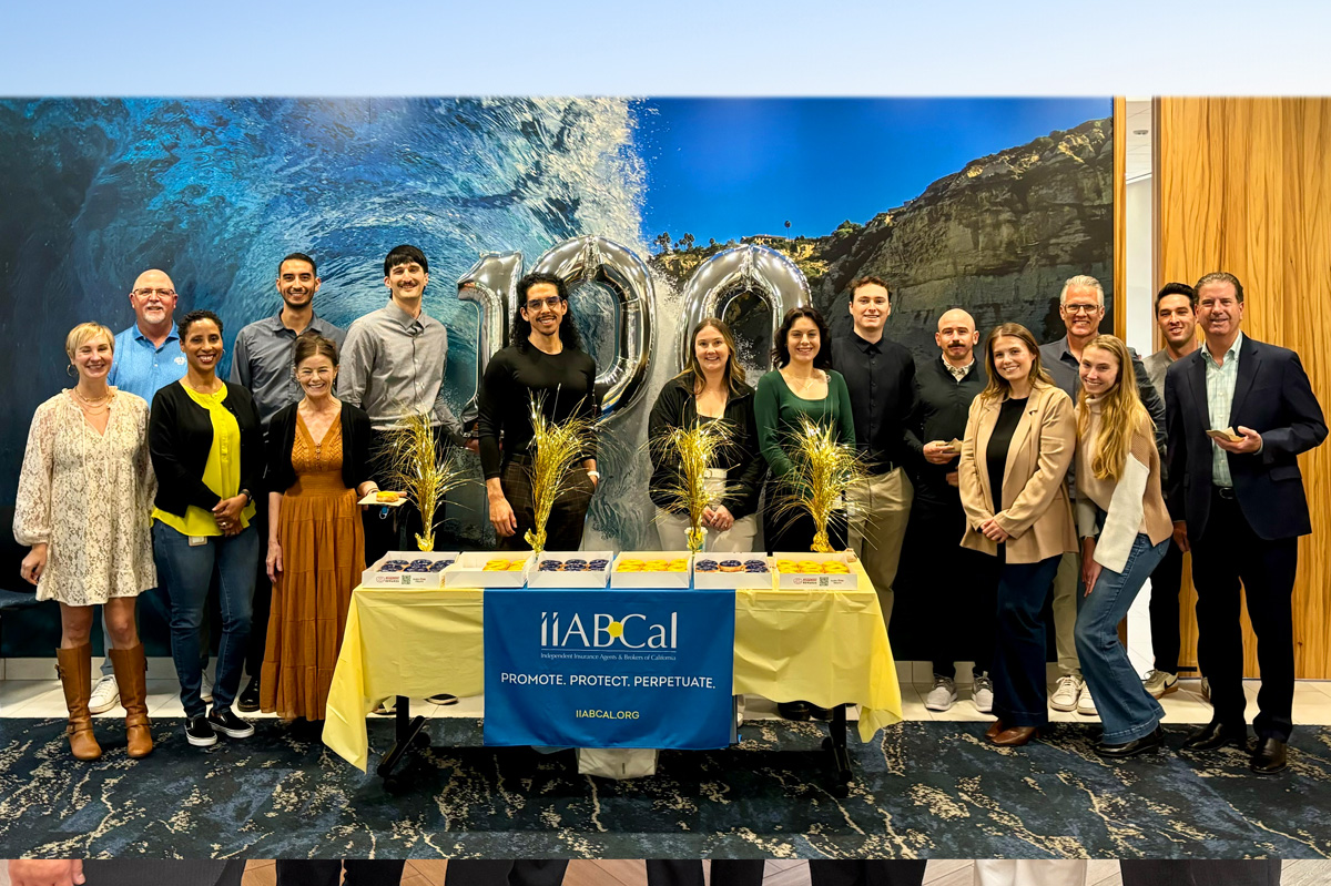 Attendees at the 2025 Installation Celebration post in front of 100